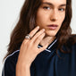 Woman wearing Pilgrim's DUNE rings, 2-in-1 set, silver-plated; featuring a sleek, chunky design, showcased on her hand with long hair visible.