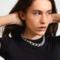 Woman wearing the DUNE necklace, a silver-plated piece from Pilgrim's IMAGINATION collection, featuring chic chunky links, emphasizing urban style.