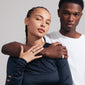 Man and woman posing, showcasing Pilgrim's FOCUS crystal ring gold-plated on hand, a bold, adjustable statement piece adorned with Preciosa crystals.