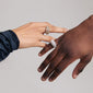 Close-up of a hand wearing Pilgrim's FOCUS crystal ring gold-plated, featuring a chunky design with shiny Preciosa crystals, exuding a bold, high-class look.