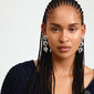 Close-up of a woman wearing Pilgrim's TIDE silver-plated earrings, featuring uniquely shaped hearts, highlighting the jewelry's intricate design and stylish appeal.