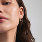 FEEL earrings gold-plated on a woman's ear, showcasing stylish rectangular hoops with a minimalist design, embodying Pilgrim's urban Scandi aesthetic.