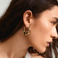 DAWN hoop earrings, gold-plated with face design. Elegant, handcrafted from 99% recycled material. Ideal for both special occasions and casual looks.