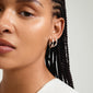 Close-up of a woman wearing Pilgrim's DAWN silver-plated hoop earrings, showcasing their elegant, handcrafted design and versatile style.