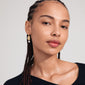 TRUE gold-plated earrings showcase uneven textured coins with genuine freshwater pearl pendants, embodying stylish class and individuality. Crafted with 77% recycled materials.