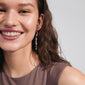 Woman smiling, showcasing Pilgrim's INTENT chain earrings, silver-plated with genuine freshwater pearls, highlighting their organic, boho-inspired design.