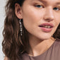 Woman wearing INTENT chain earrings, silver-plated with freshwater pearl, showcasing Pilgrim's boho-inspired, handcrafted style. Close-up highlights elegant, organic design.