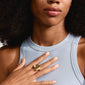 Close-up of a woman's hand wearing the gold-plated RYAN ring from the Pilgrim IMAGINATION collection, featuring a handcrafted heart design.