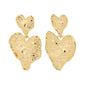 Gold-plated RYAN heart-shaped earrings from Pilgrim, showcasing a rustic, handcrafted design, made from 98% recycled materials for a luxe boho vibe.