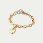 Gold-plated CHARM bracelet featuring a heart-shaped charm on a delicate cable chain, perfect for stacking and showcasing personal style. Made from 97% recycled material.