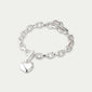 Silver-plated CHARM bracelet with heart charm, featuring an adjustable cable chain design, ideal for stacking and expressing personal style. Made from 97% recycled material.