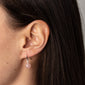 GOLDIE rose earrings silver-plated, featuring pink-tinted glass beads on silver hooks, elegantly showcased on a woman's ear. Perfect accessory for a romantic, feminine style.