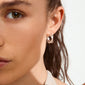 Close-up of a woman's face showcasing Pilgrim's silver-plated KIRA earrings adorned with sparkling Preciosa crystals, highlighting their elegance and eco-friendly craftsmanship.