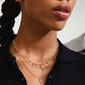 JULES necklace gold-plated on woman, featuring layered chains with Preciosa crystals and organic heart pendants, highlighting a bohemian summer style.