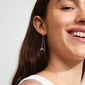 LYSANDRA chain earrings silver-plated worn by a smiling woman, showcasing the long silver chain with bow pendants, ideal for versatile, stylish looks.