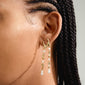 SLOAN pearl earrings, gold-plated; close-up of earlobe adorned with organic, boho-style earrings featuring gold accents and white pearls, reflecting Pilgrim's timeless, trendy design.