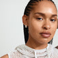 Close-up of a woman wearing Pilgrim's JUA silver-plated chunky bubble dome earrings, highlighting their retro, robust design.