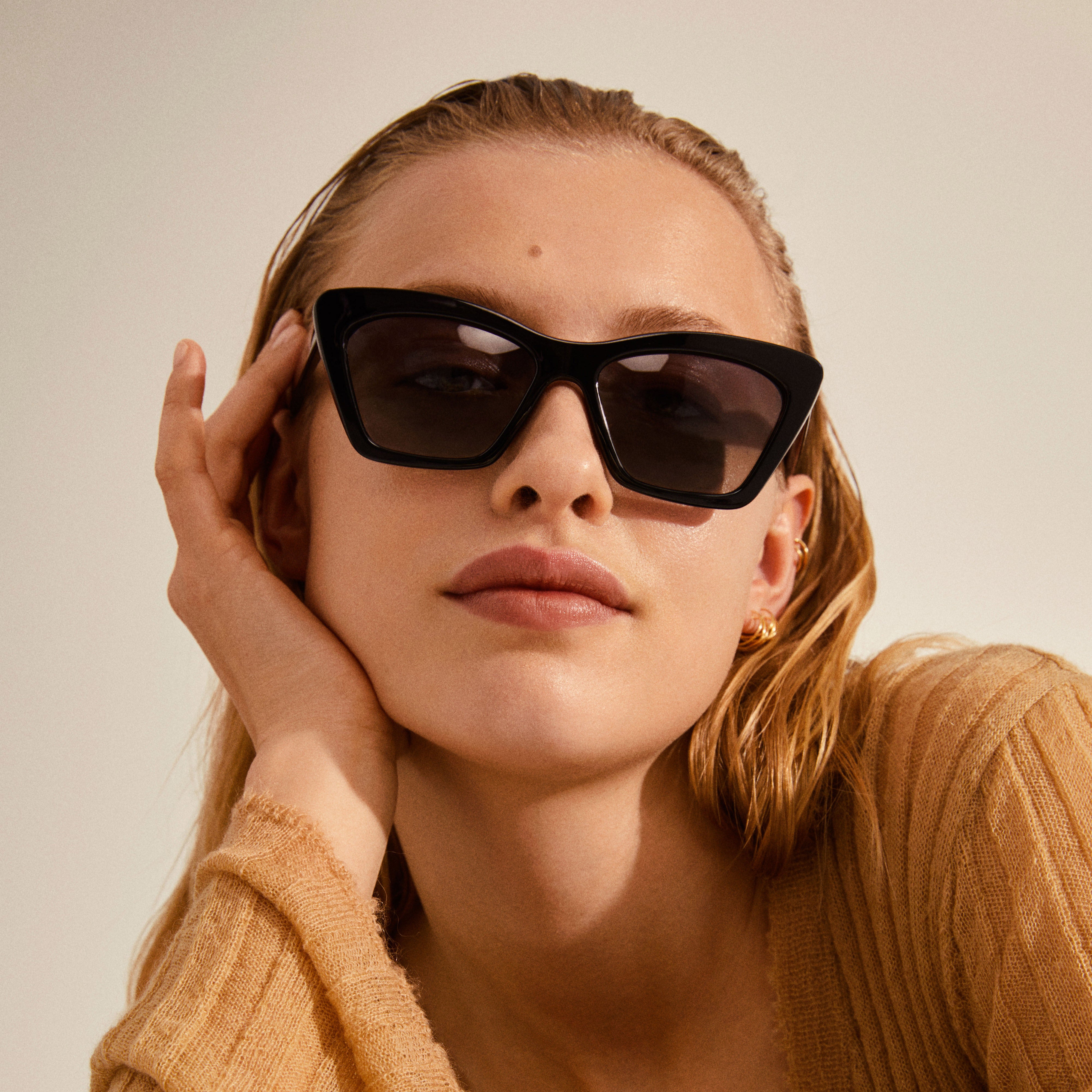 With an angular cat-eye silhouette and a chic brown finish | FhyzicsShops  DESIGN cat eye sunglasses with squared frame and smoke lens in crystal red  | FhyzicsShops