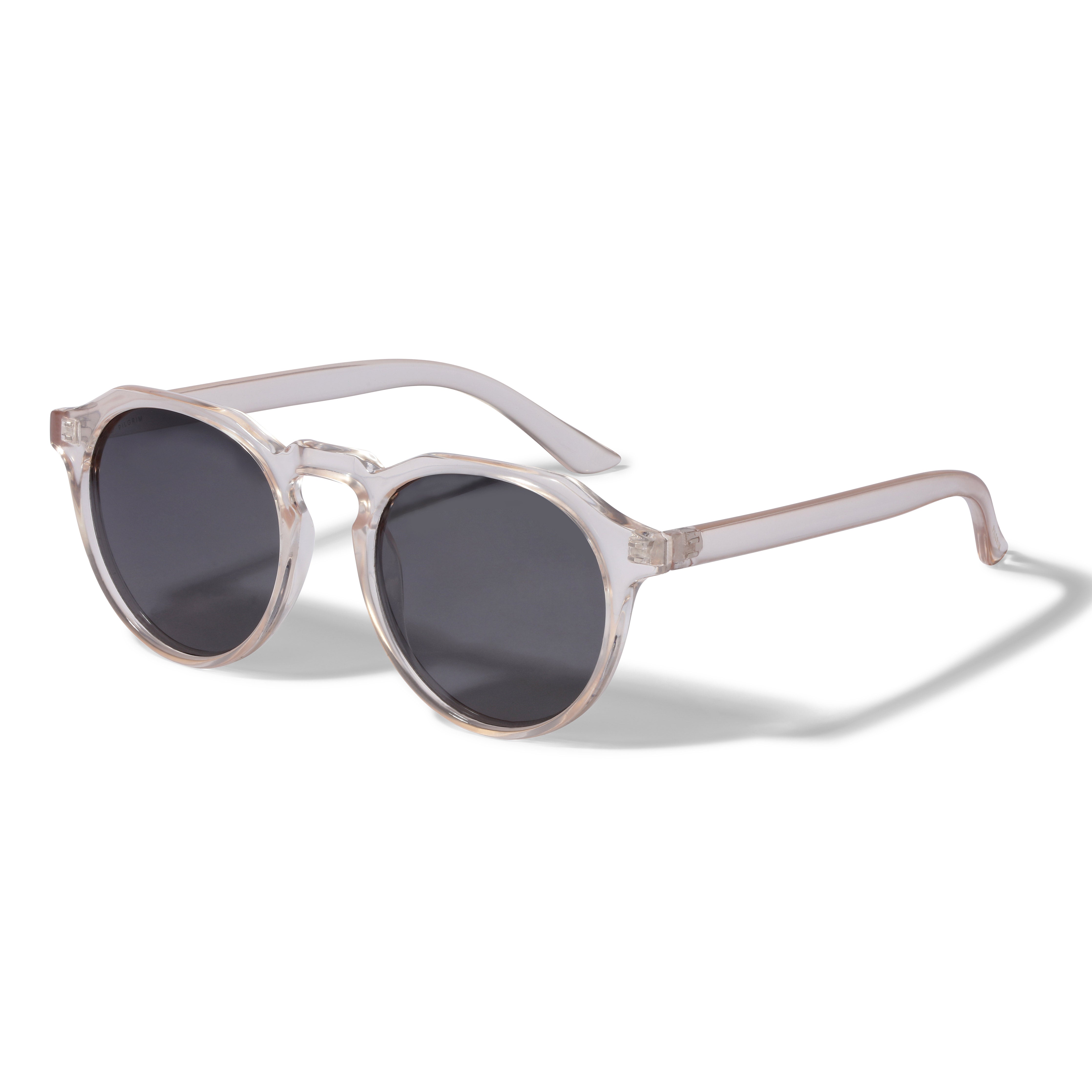 ALEJANDRA sunglasses with crystal clear frames and smoke-colored lenses, featuring a trendy, minimalist design for a stylish spring look. Includes UVA/UVB protection.